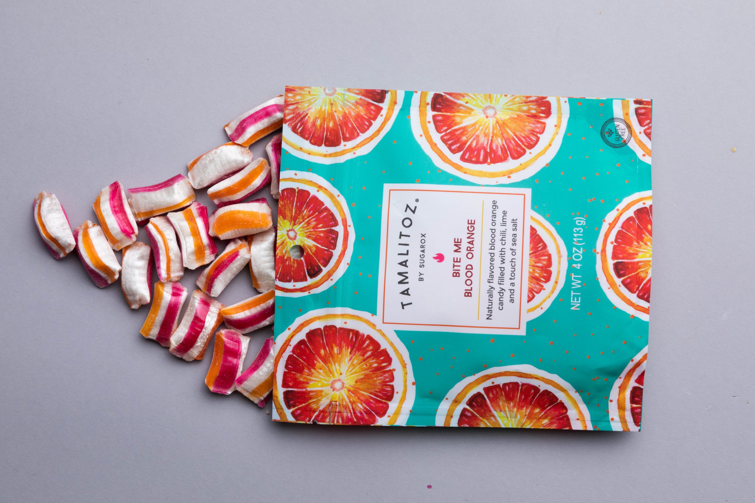 Blood Orange Tamalitoz pouch and candy laying down scaled